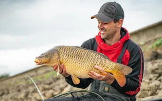 Angler Adam Rooney with a carp at Harthill Reservoir