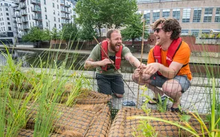 two men planting and volunteering by the canal in Nottingham