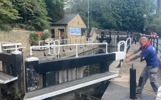 Man operating a lock gate