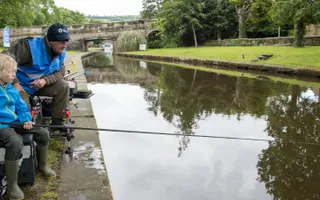 Girl learns to fish at Let's Fish, Trevor Basin, credit Johnathan Goldberg, Flow Photo