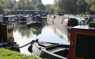 A group of canal boats moored in a basin