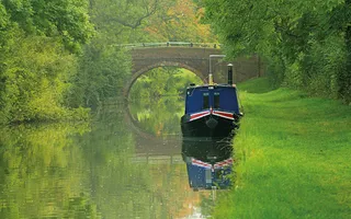 Boat moored on a rural stretch of the Grand Union Canal near Foxton