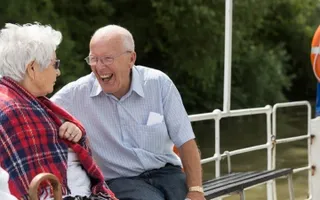 A couple enjoying a cruise along the Gloucester & Sharpness Canal on board Queen Boadicea II