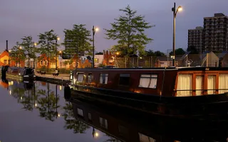 Boats at a city mooring at night
