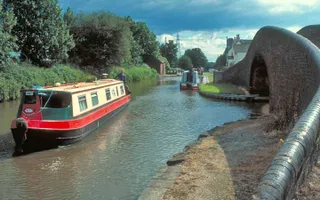 Narrowboats next to bridge on Coventry Canal