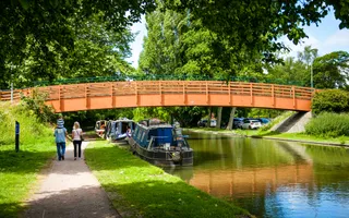 family walking on a sunny day along Grand Union Canal in Berkhamsted