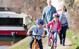 Children cycling on the canal towpath