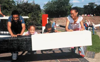 Family opening a lock gate at Foxton