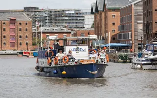 Boat moving along the canal outside the National Waterways Museum Gloucester