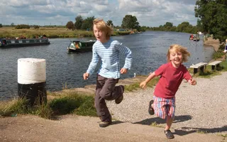 Family running on the towpath