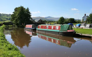 Boats moored on the Monmouthshire & Brecon Canal in summer