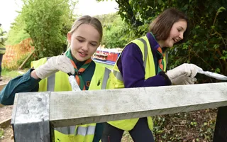 Scouts painting a lock gate