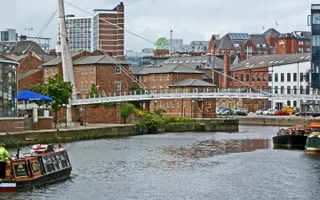 Narrowboat on River Aire traveling towards Leeds City Centre